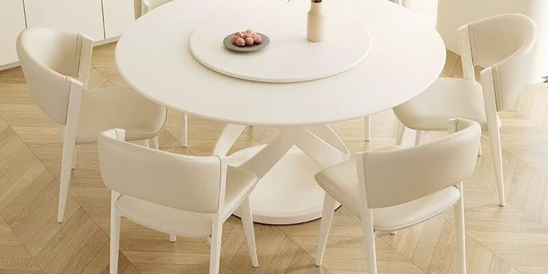 White cream-style minimalist round ceramic dining table